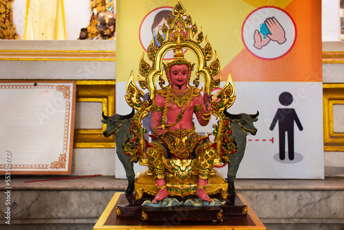 Pink ancient angel deity lord statue of tuesday for thai people travel visit respect praying and blessing mystical myth holy at Wat Raikhing or Rai khing temple at Sam Phran in Nakhon Pathom, Thailand photo