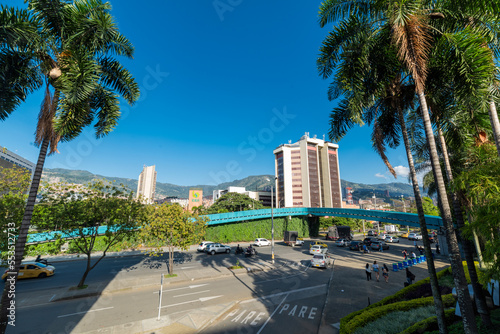 Medellin, Antioquia, Colombia. January 13, 2022: Landscape with beautiful blue summer sky in main square and view of pedestrian bridge.