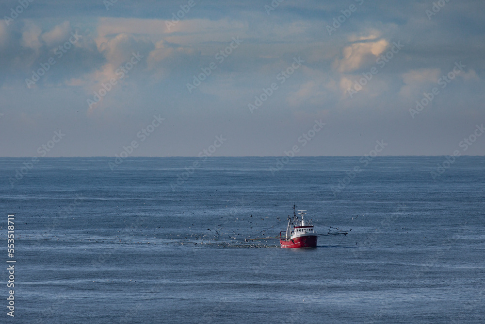 A cutter with lifted drag nets on the North sea