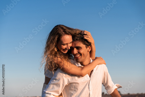 Woman and man embraced happy in a lavender field