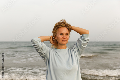 Portrait of a pretty woman on the sea