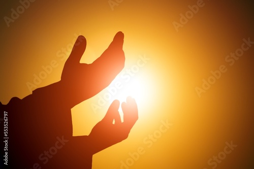 Person hands worship to god outdoor