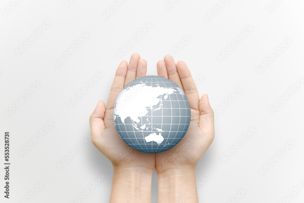 A globe in the palm of hand. A globe in the palm of hand.