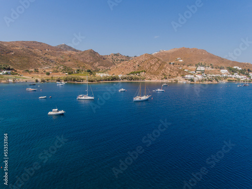 Aerial view of sailing boats in the natural harbor at Aegean Sea of Patmos island, Greece