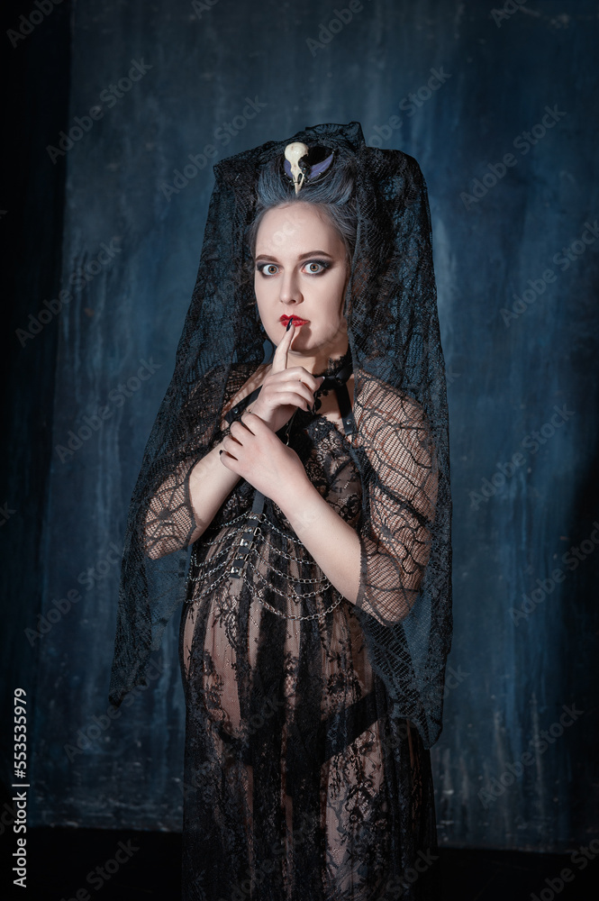 Beautiful demon style woman with finger on lips Beautiful demon style woman with finger on lips