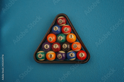 Pool table Billiard snooker ball Game room entertainment. Snooker balls blue background. Billiard balls on the board. Pool table with rack of balls. The concept of sports board games