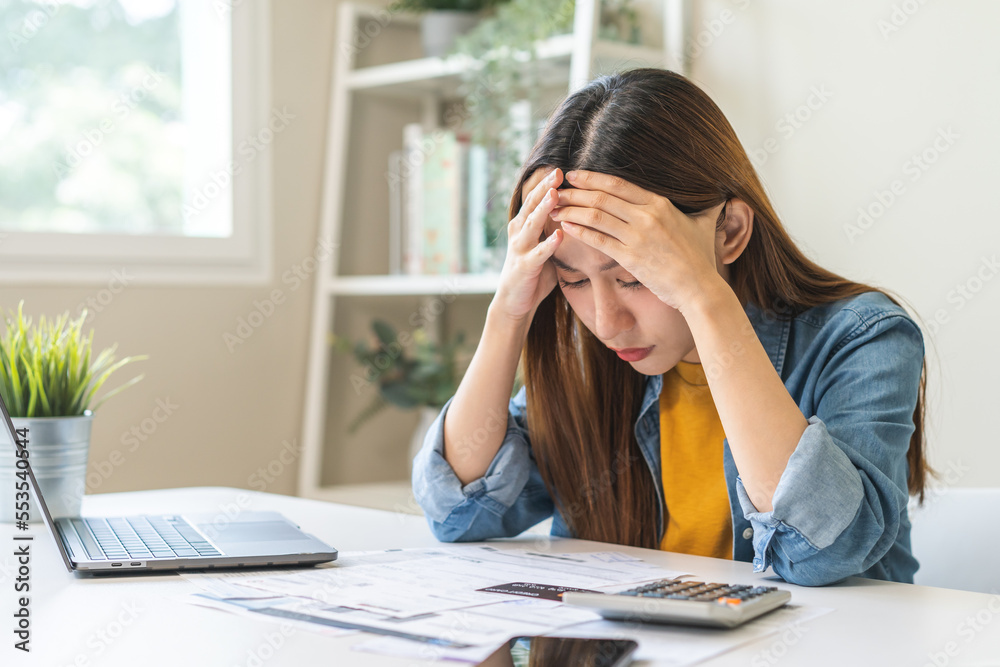 Φωτογραφία Financial owe asian woman sitting cover face with hands, stressed by calculate expense at home, looking at invoice or bill, have no money to pay, mortgage or loan