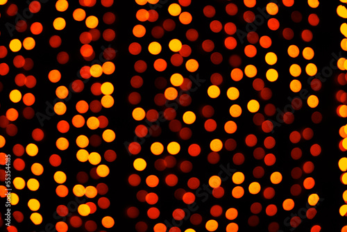 Beautiful red night bokeh light, abstract blur defocused background. Colorful overlay glitter lights for layout design. Boke glows concept of Celebration, Christmas or festival seasonal background.