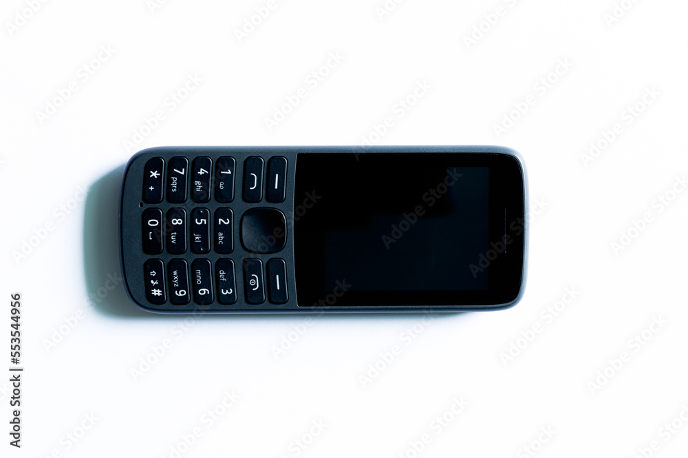 Push-button phone on a white background,simple mobile phone isolated on white background Push-button phone on a white background,simple mobile phone isolated on white background