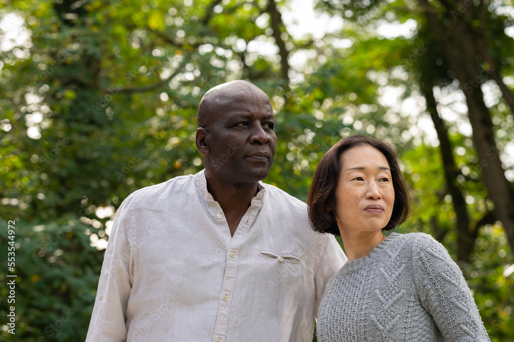 Portrait of middle -aged diverse couple enjoying a day outdoors Portrait of middle -aged diverse couple enjoying a day outdoors