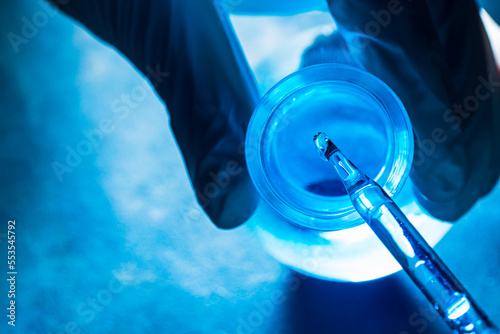 blue science test tube,Researchers scientist working analysis with blue liquid test tube in the laboratory, chemistry science or medical biology experiment technology, pharmacy development solution photo