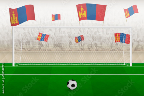 Mongolia football team fans with flags of Mongolia cheering on stadium, penalty kick concept in a soccer match.