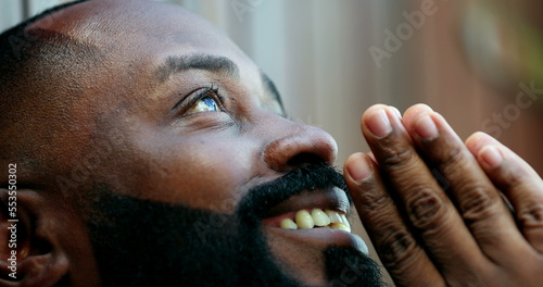 Fotografia African man opening eyes awakening to a new day