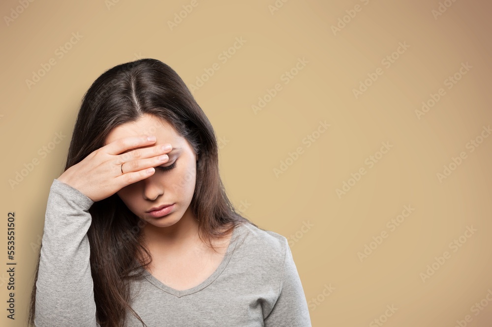 Sad or sick woman with headache, feeling stressed Sad or sick woman with headache, feeling stressed