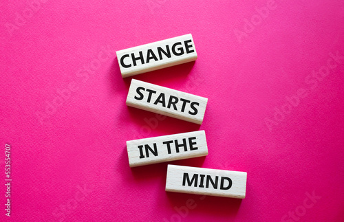 Change starts in the mind symbol. Concept words Change starts in the mind on wooden blocks. Beautiful red background. Business and Change starts in the mind concept. Copy space photo