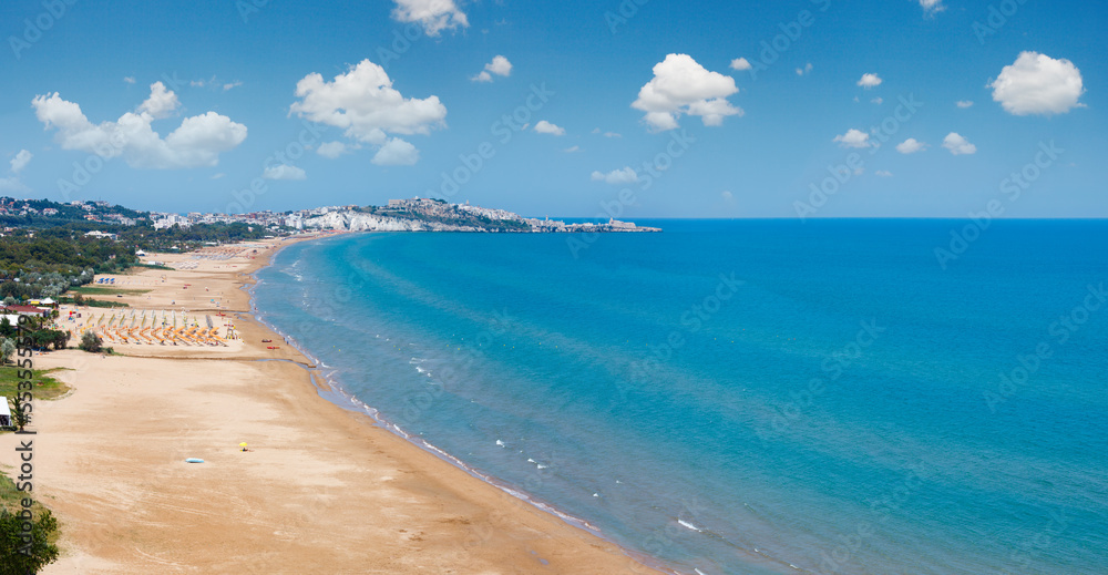 Summer Lido di Portonuovo Adriatic sea beach view (Vieste, Gargano peninsula, Puglia, Italy). People are unrecognizable.