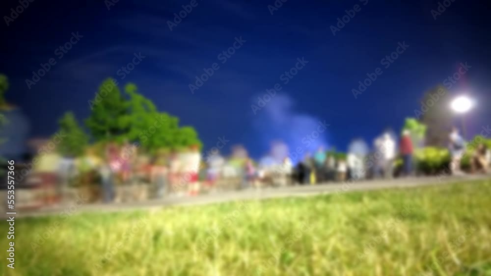 Blurred Timelapse Of Tourists At Night Walking Around Taking Pictures Diverse Group