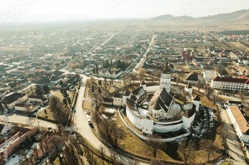 Feldioara Fortress is a medieval fortification in Romania near Brasov in the Transylvanian region. Fortress is one of the oldest and best preserved fortifications in the area. Aerial castle photo photo