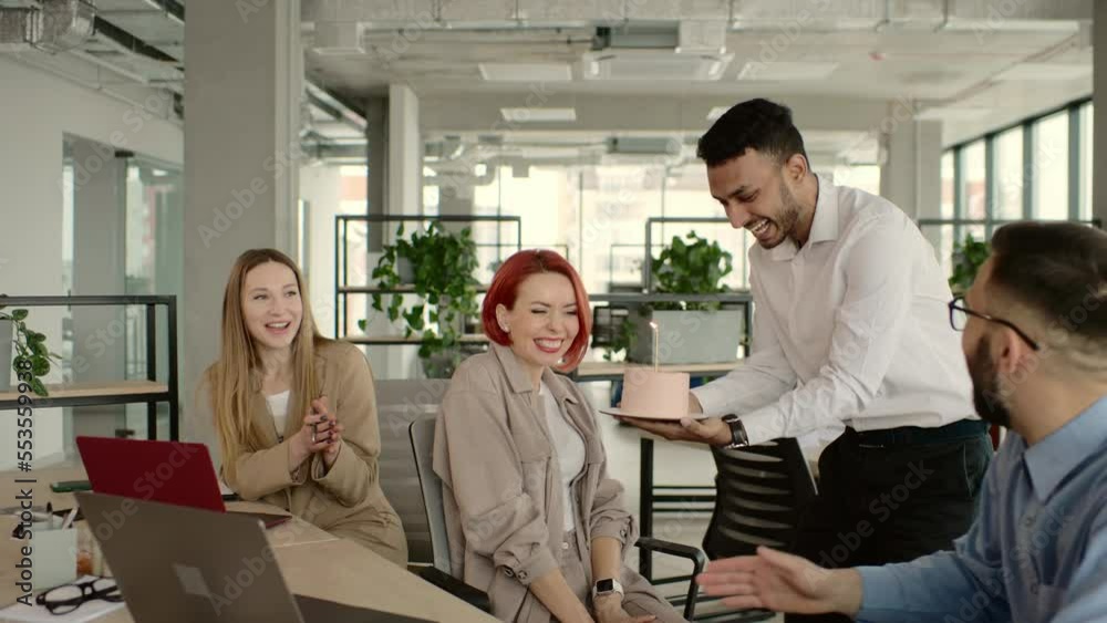 Surprise. Mixed race happy people celebrating a birthday of colleague in the modern office
Surprise. Mixed race happy people celebrating a birthday of colleague in the modern office