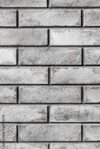 Modern gray abstract brick vertical wall urban facade interior texture grey pattern background