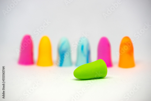 Set of colorful earplugs isolated on white background with space for copytext