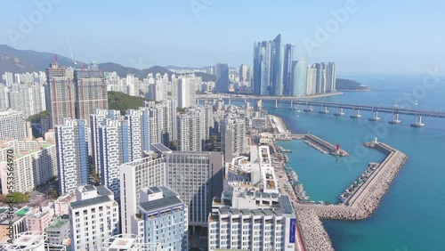 Busan: Aerial view of city in South Korea, skyline of Haeundae and Suyeong district with modern high-rise buildings, sunny day with blue sky - landscape panorama of Eastern Asia from above photo