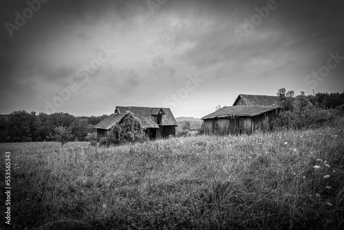 Abandoned 19th century house in a rural field in Glanz, Austria. photo