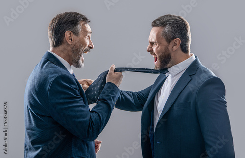 businessmen have conflict in studio. conflict of businessmen shouting. photo of businessmen photo