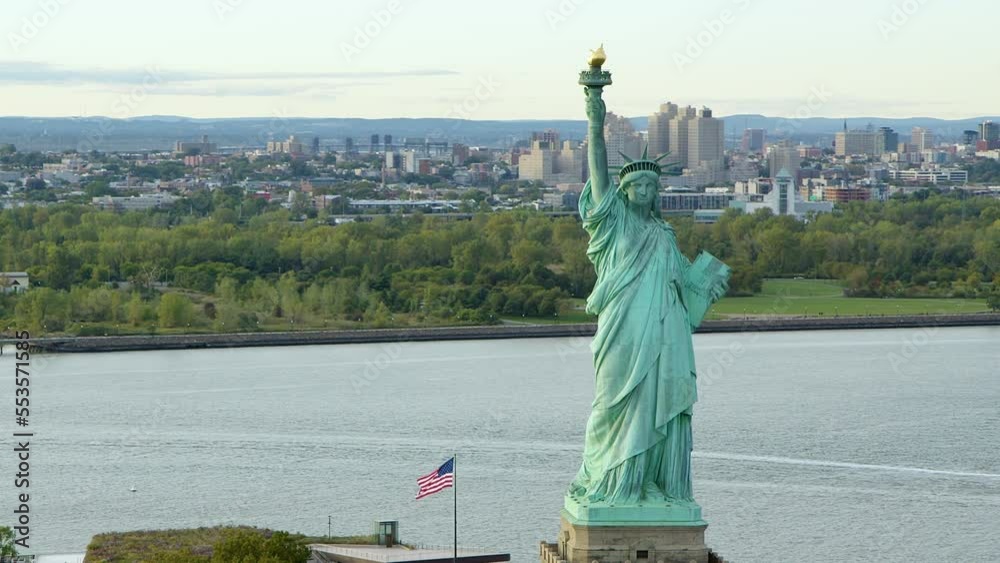 Aerial View Of The Statue Of Liberty Orbiting At Daylight, New York City. New York Aerial Shot. Wide Shot.
US. Flag. United States. High Quality Footage Shot from Helicopter.