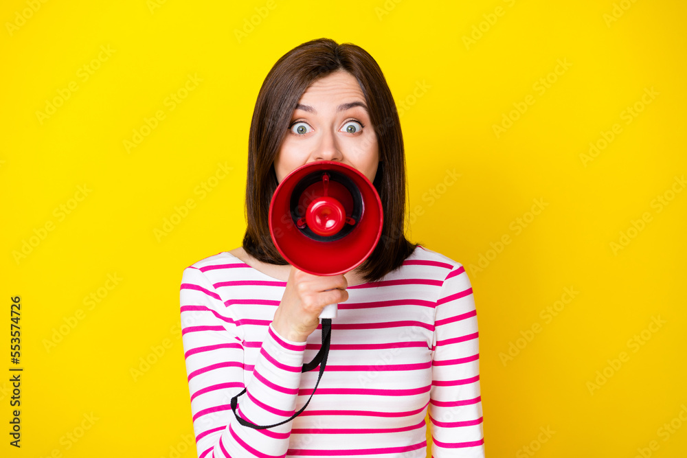 Fototapeta premium Photo of pretty woman lady promoter arm hold megaphone announces sale clothes shop center isolated on yellow color background