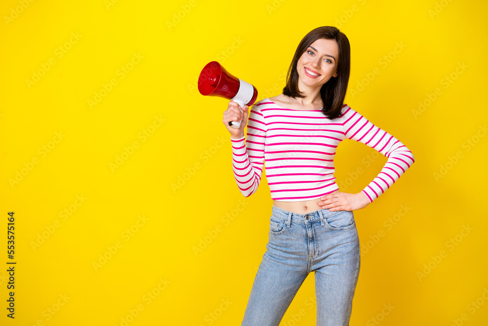 Photo of petty cute girl lady stand empty space arm hold microphone ready announce low prices clothes isolated on yellow color background Photo of petty cute girl lady stand empty space arm hold microphone ready announce low prices clothes isolated on yellow color background