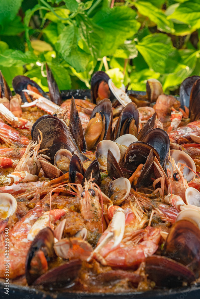 Paella with seafood close-up, vertical photo Paella with seafood close-up, vertical photo