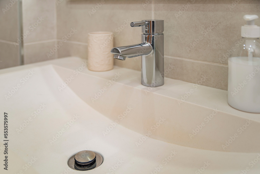 Fototapeta premium Creamy white bathroom sink photo without people