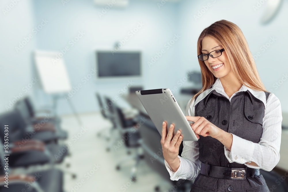 Young woman journalist inoffice with digital tablet Young woman journalist inoffice with digital tablet