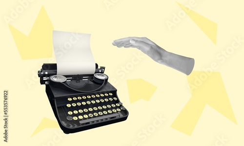 Foto Creative arm typing on retro typewriter