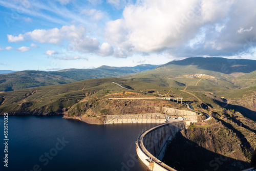 High angle view landscape of concrete dam of El Atazar with a beautiful clouds in the sky, Madrid, Spain