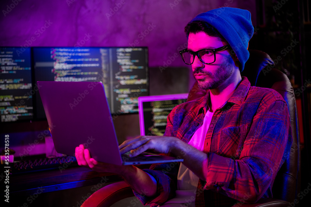 Photo of serious confident freelancer wear hat eyeglasses eb designing modern gadget indoors workplace workstation loft Photo of serious confident freelancer wear hat eyeglasses eb designing modern gadget indoors workplace workstation loft