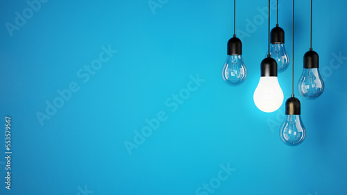 Konstfotografi The concept of a light bulbs on blue background, place for text and design, ligh
