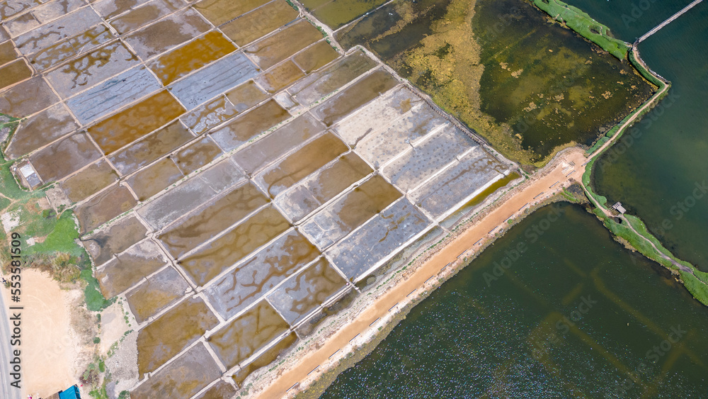 Fototapeta premium Aerial shot of Salinas de Cáhuil and Laguna Cáhuil (Pichilemu) – Chile 