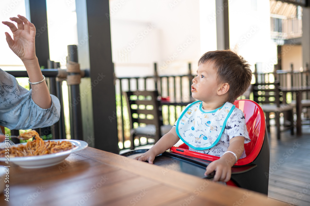 one-and-half-year-old-baby-boy-having-a-meal-in-the-restaurant-with-his