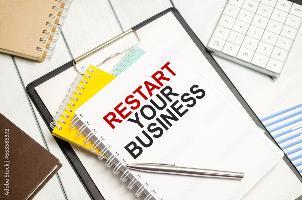 restart your business . Conceptual background with chart ,papers and pen