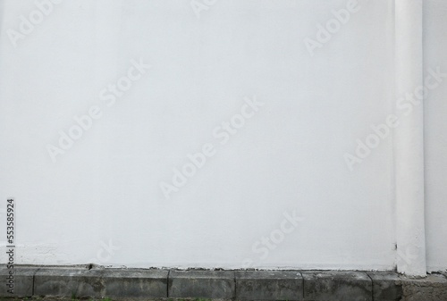 White stone wall of building outdoors. Exterior design