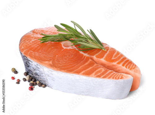 Fresh raw salmon steak with rosemary and peppercorns on white background