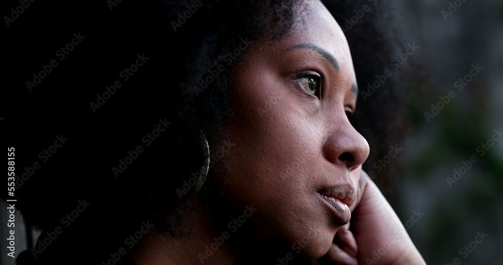Contemplative African woman thinking, close-up black person face thoughtful