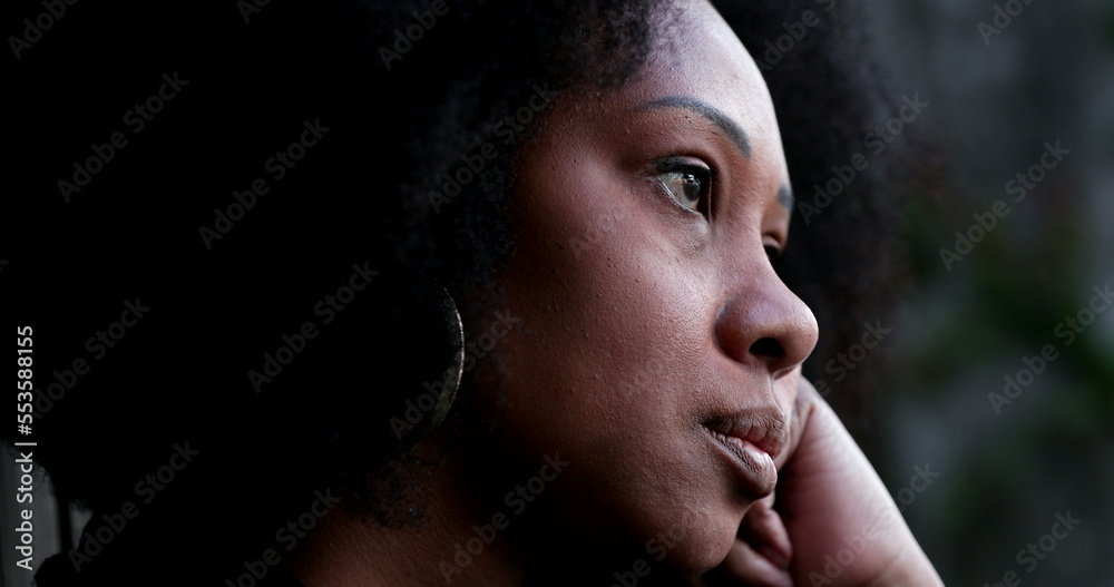 Contemplative African woman thinking, close-up black person face thoughtful Contemplative African woman thinking, close-up black person face thoughtful