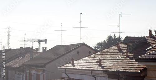 Aerial photo of the roofs of buildings during a winter sunrise