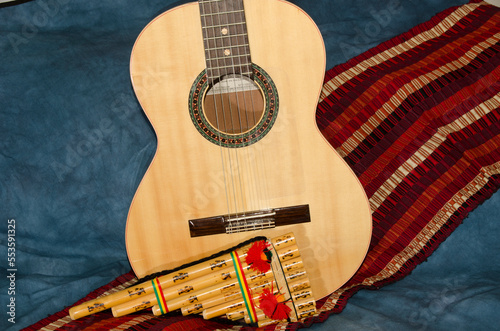 Music Instruments, Guitar and Zampoña on a background