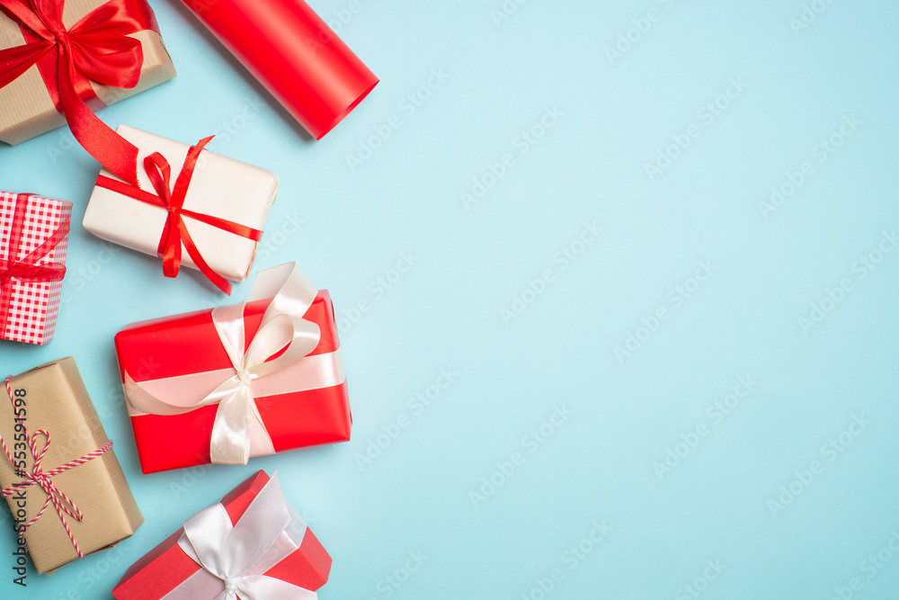Christmas presents on blue background top view. Christmas presents on blue background top view.