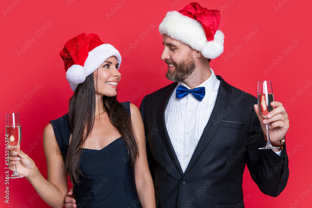 merry christmas to happy santa couple in studio. christmas celebration of santa couple. merry christmas to happy santa couple in studio. christmas celebration of santa couple.