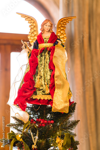 close up of angel on top of Christmas tree 